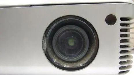 How to maintain and clean the projector lens?